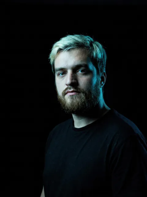Tvardovsky, portrait with teal backlight, 2026